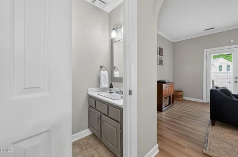 a kitchen with granite countertop a sink stainless steel appliances and window