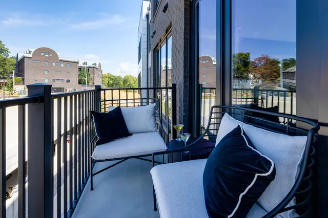 a view of balcony with a potted plant