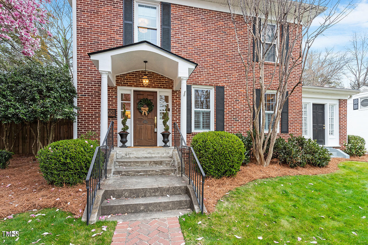 1310 Williamson Drive Raleigh, NC 27608 - Photo 2 of 43 a front view of a house with garden