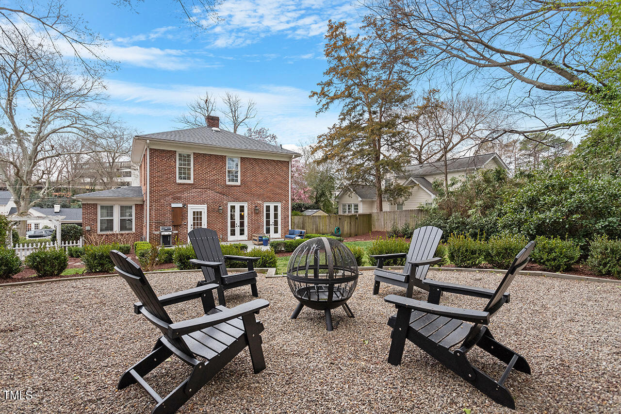 1310 Williamson Drive Raleigh, NC 27608 - Photo 4 of 43 a view of a brick house with outdoor seating area