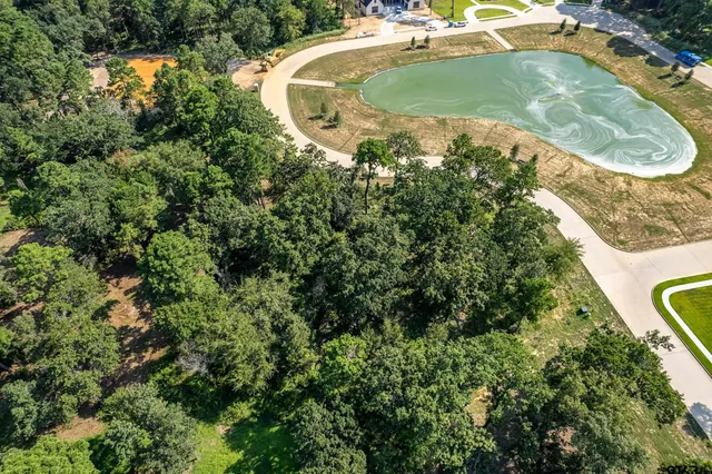 an aerial view of a house with a swimming pool