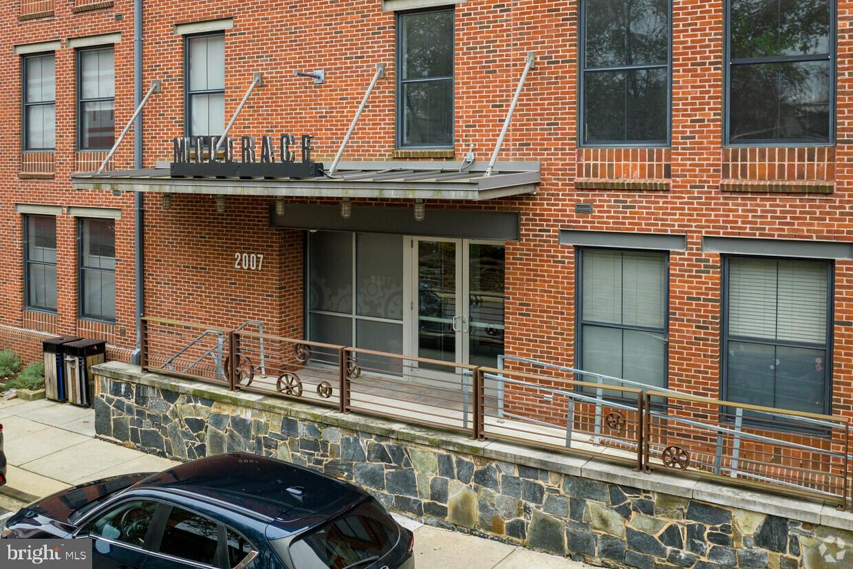 2007 Clipper Park Road, Unit 123 Baltimore, MD 21211 - Photo 1 of 25 a view of a roof deck with chair and wooden floor