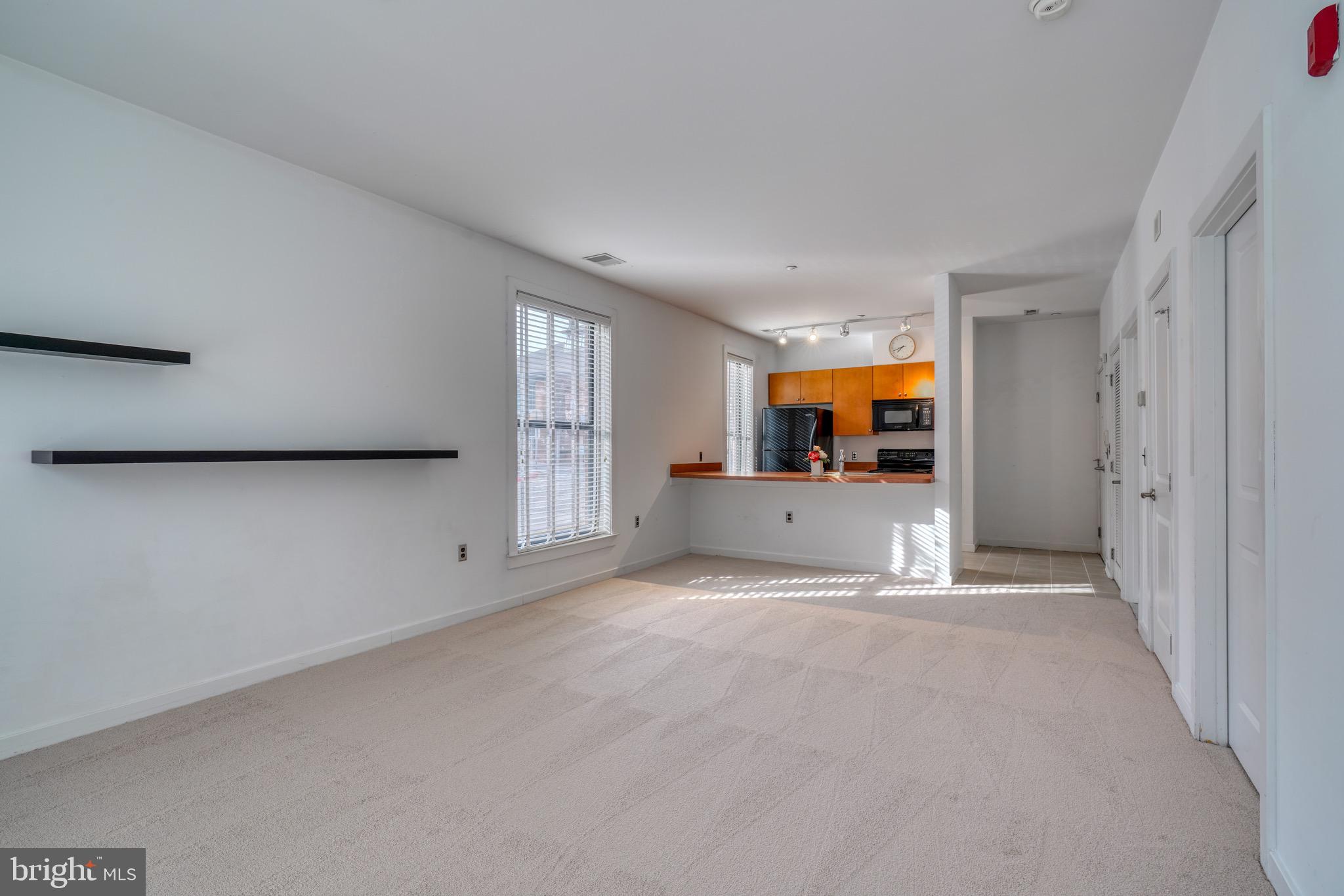 2007 Clipper Park Road, Unit 123 Baltimore, MD 21211 - Photo 11 of 25 a view of a big room with windows and cabinet