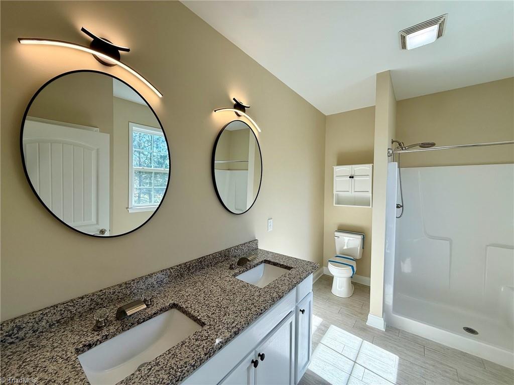 2212 Becks Church Road Lexington, NC 27292 - Photo 14 of 34 Primary bathroom with a new double vanity.