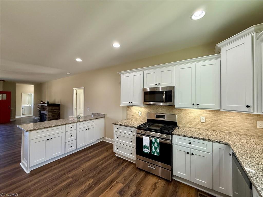 2212 Becks Church Road Lexington, NC 27292 - Photo 4 of 34 Enjoy coffee at your kitchen peninsula featuring a new countertop.