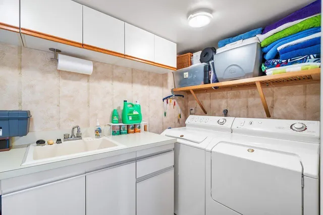 a utility room with dryer and washer