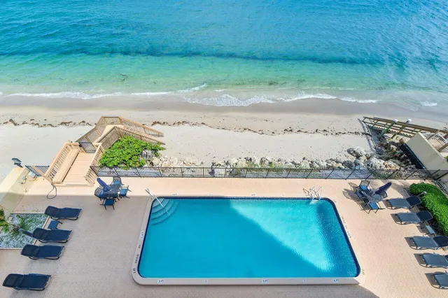 a view of swimming pool from a balcony