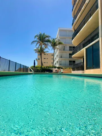 a front view of building with yard