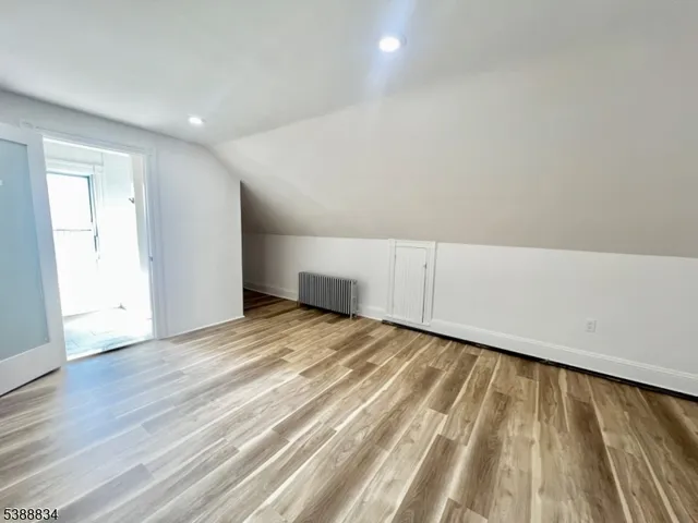 a bathroom with a double vanity sink window and mirror
