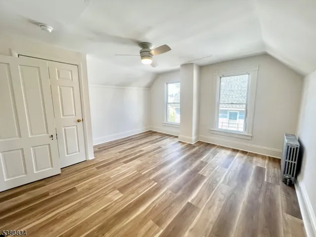 a view of a room with a ceiling fan