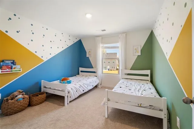 a bedroom with furniture and a wooden floor