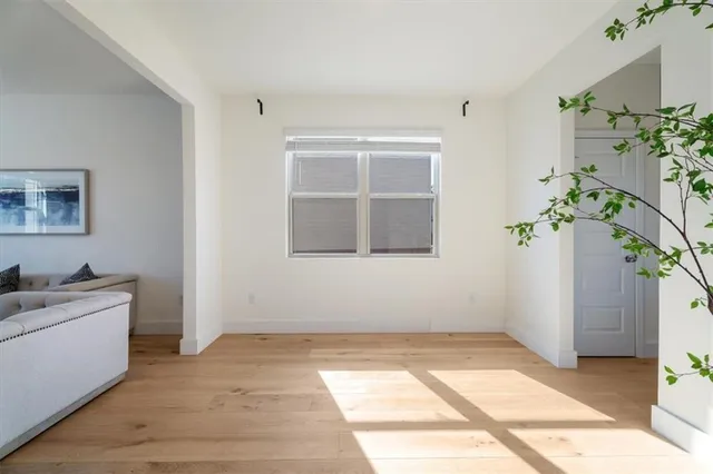 a room with a door open to a room