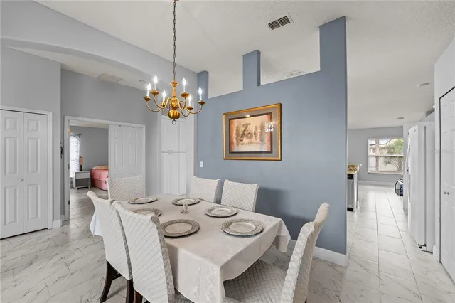 a living room with furniture and a flat screen tv with wooden floor