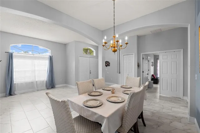 a living room kitchen with furniture and kitchen view