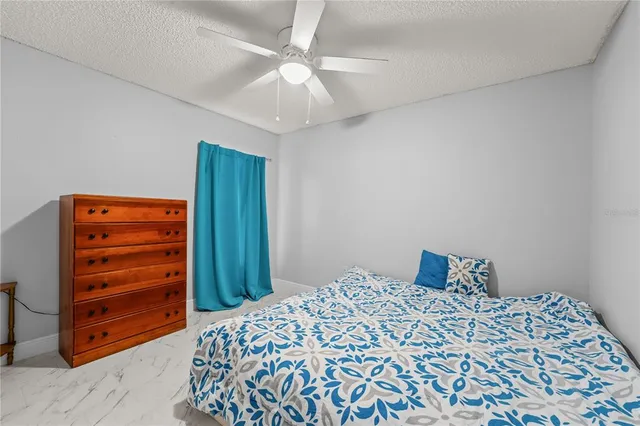 a view of an empty room with a window and balcony