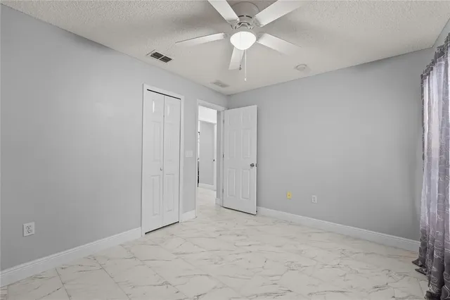 a front view of a house with garden and porch