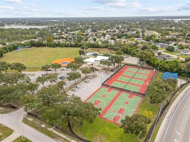 an aerial view of residential houses with outdoor space