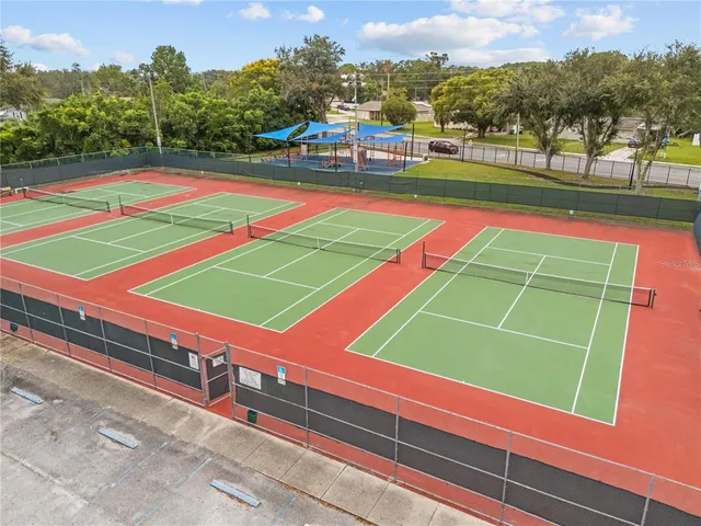 a childrens park with lots of swings and slides