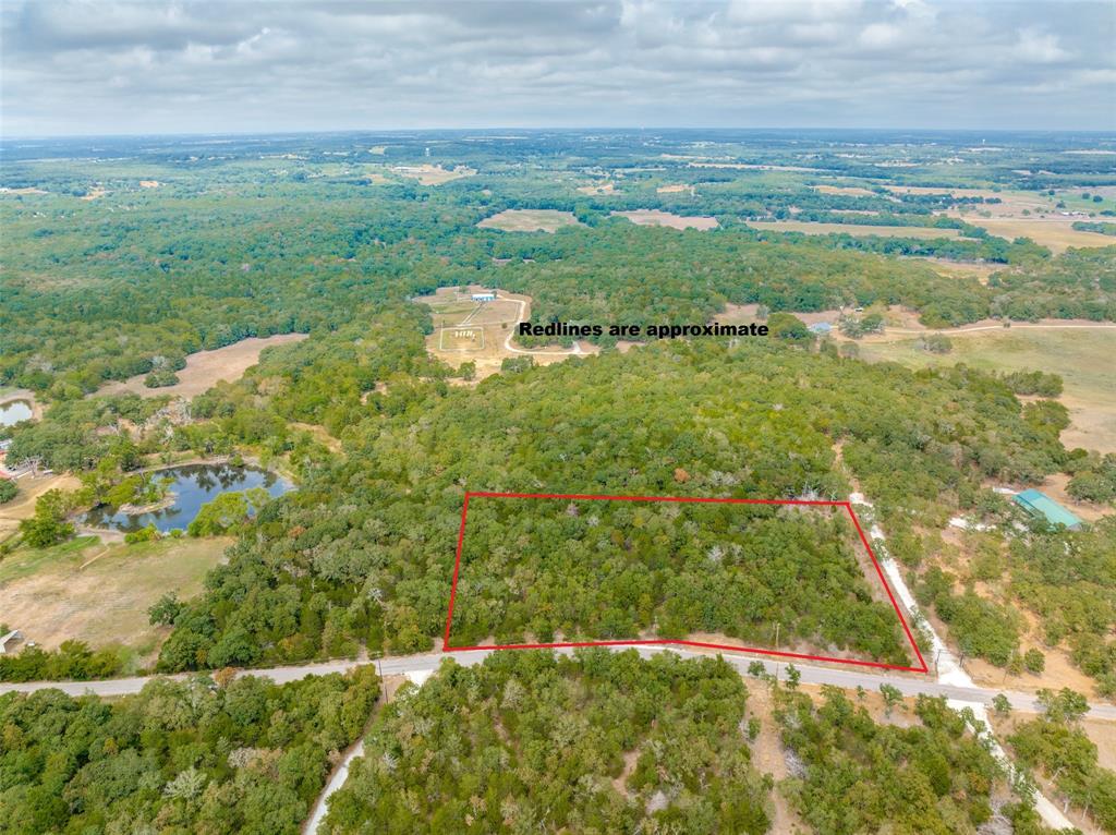 209 Red Top Road Valley View, TX 76272 - Photo 3 of 8 a view of a lake with a yard
