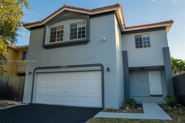 a house view with a garden space