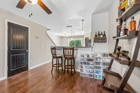 a view of a dining room with furniture window and wooden floor