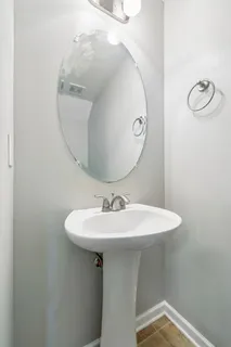 a bathroom with a sink a mirror and toilet