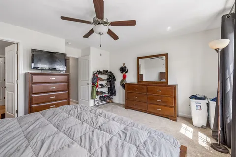 a bed room with a bed and a television