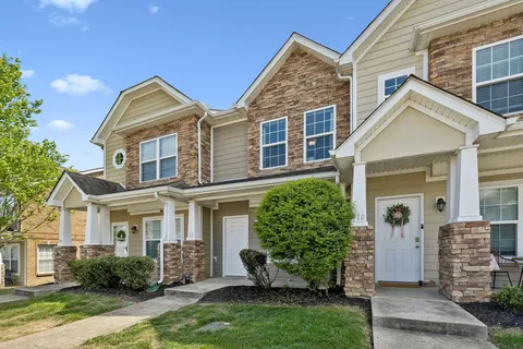front view of a house with a yard