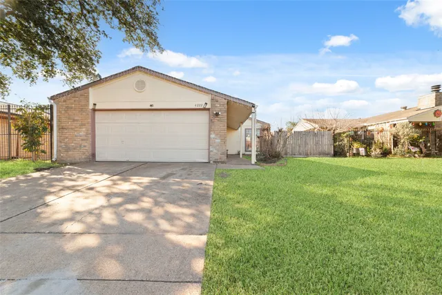 a front view of house with garden