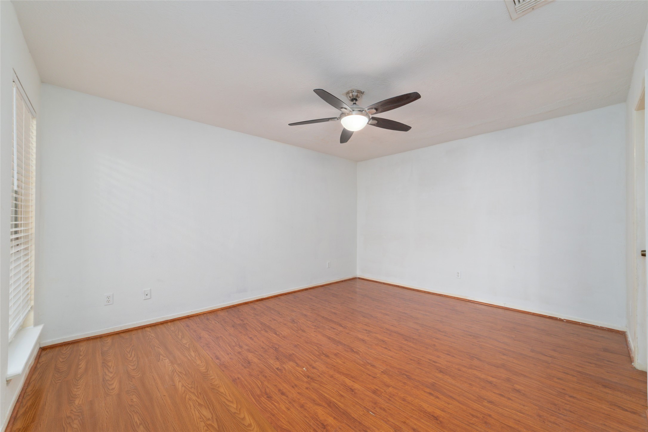 4222 Amir Street Houston, TX 77072 - Photo 16 of 21 a view of an empty room with a window