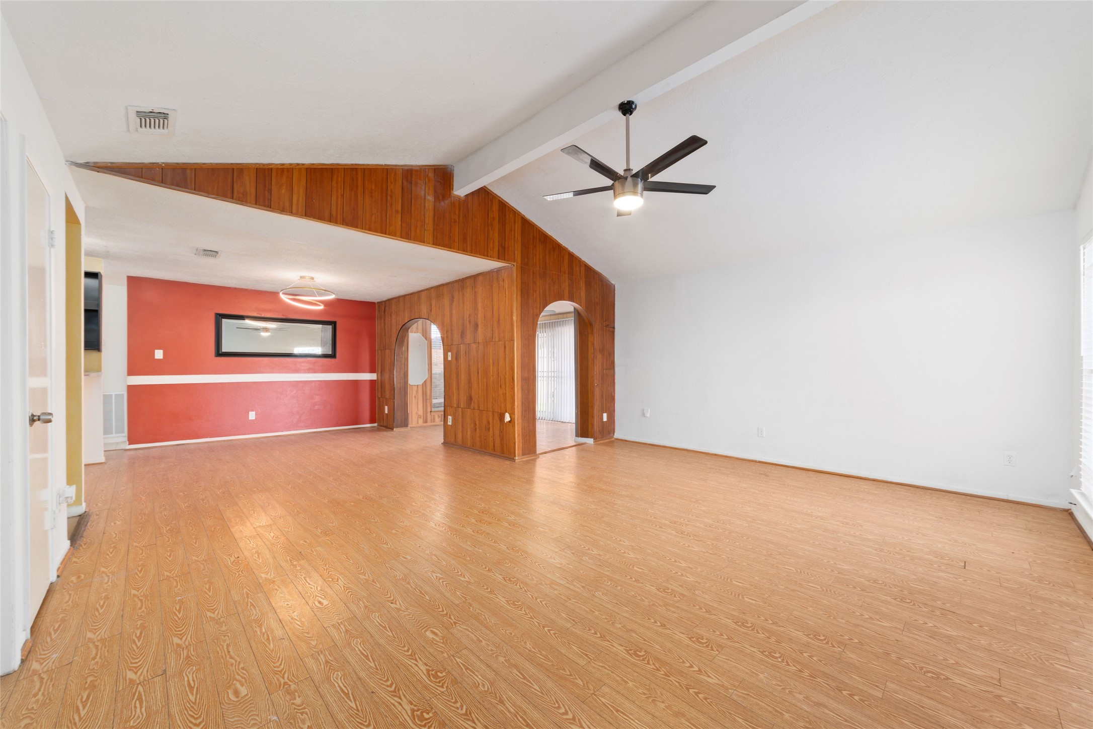 4222 Amir Street Houston, TX 77072 - Photo 4 of 21 a view of an empty room with window and a kitchen