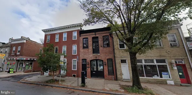 a front view of a building with street view