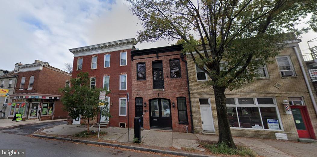 a front view of a building with street view