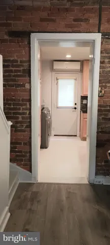 a view of a brick house with an empty space