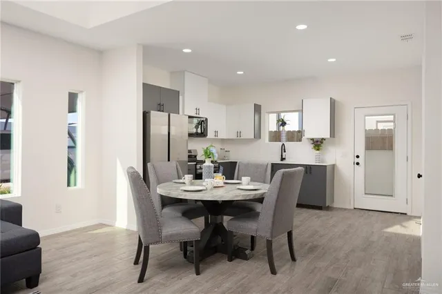 a view of a dining room with furniture and wooden floor