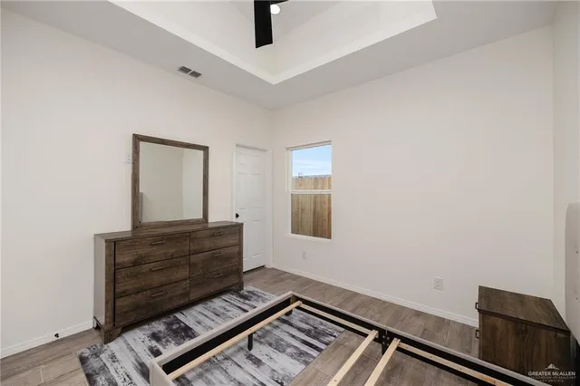 a view of room with furniture and wooden floor