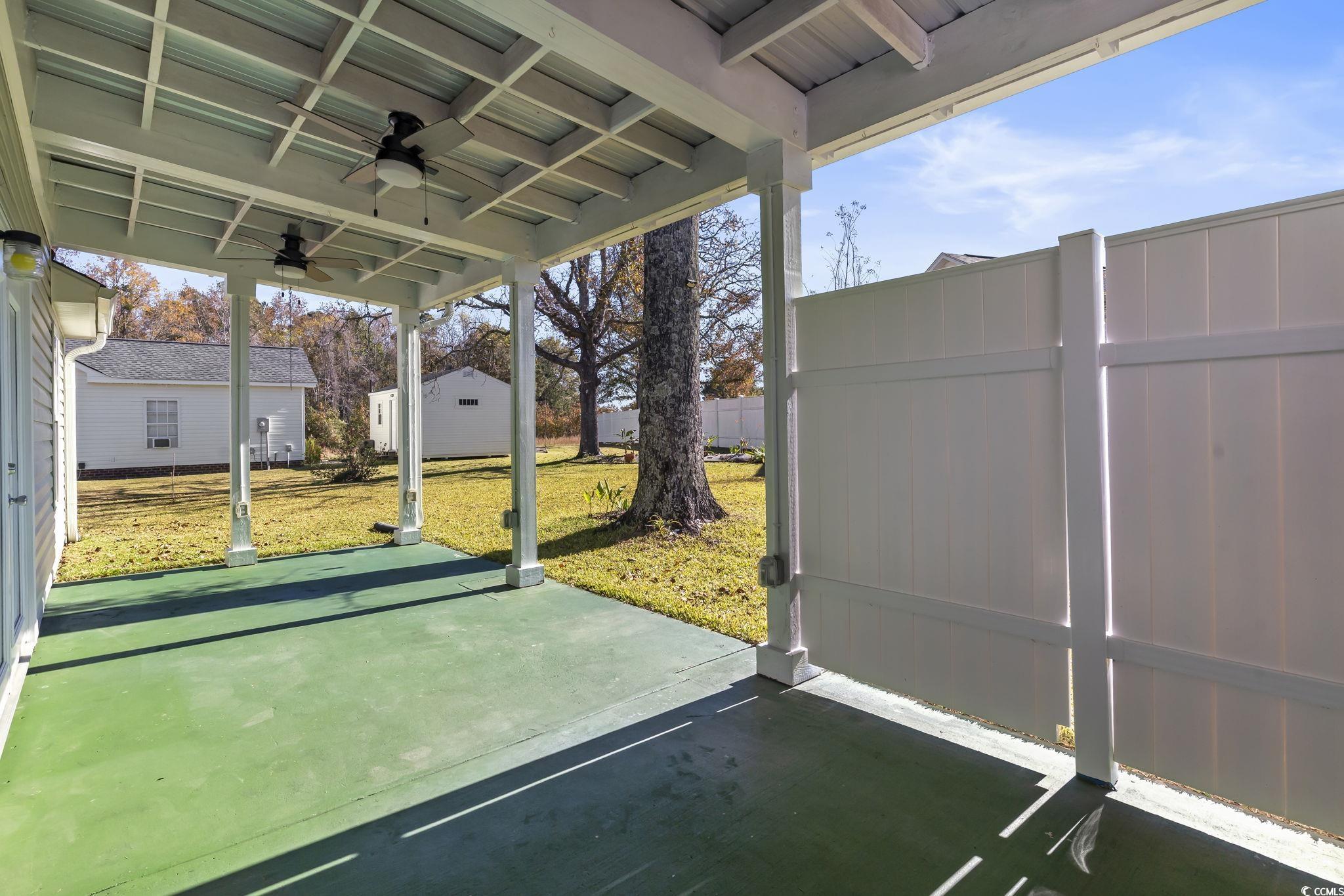 1007 Green Fir Loop Conway, SC 29527 - Photo 31 of 38 Unfurnished sunroom featuring ceiling fan and a patio