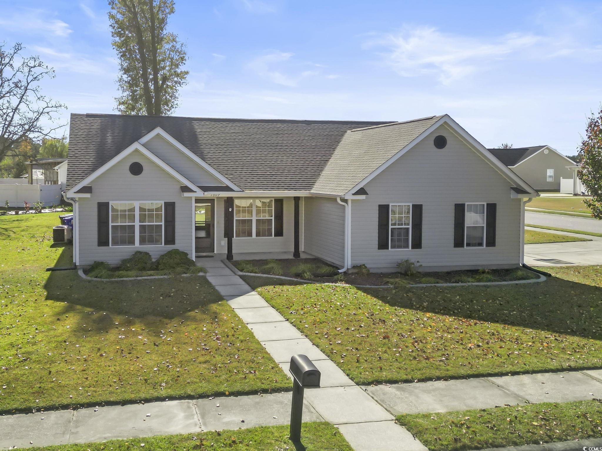 1007 Green Fir Loop Conway, SC 29527 - Photo 36 of 38 View of front of house featuring a front lawn and roof with shingles