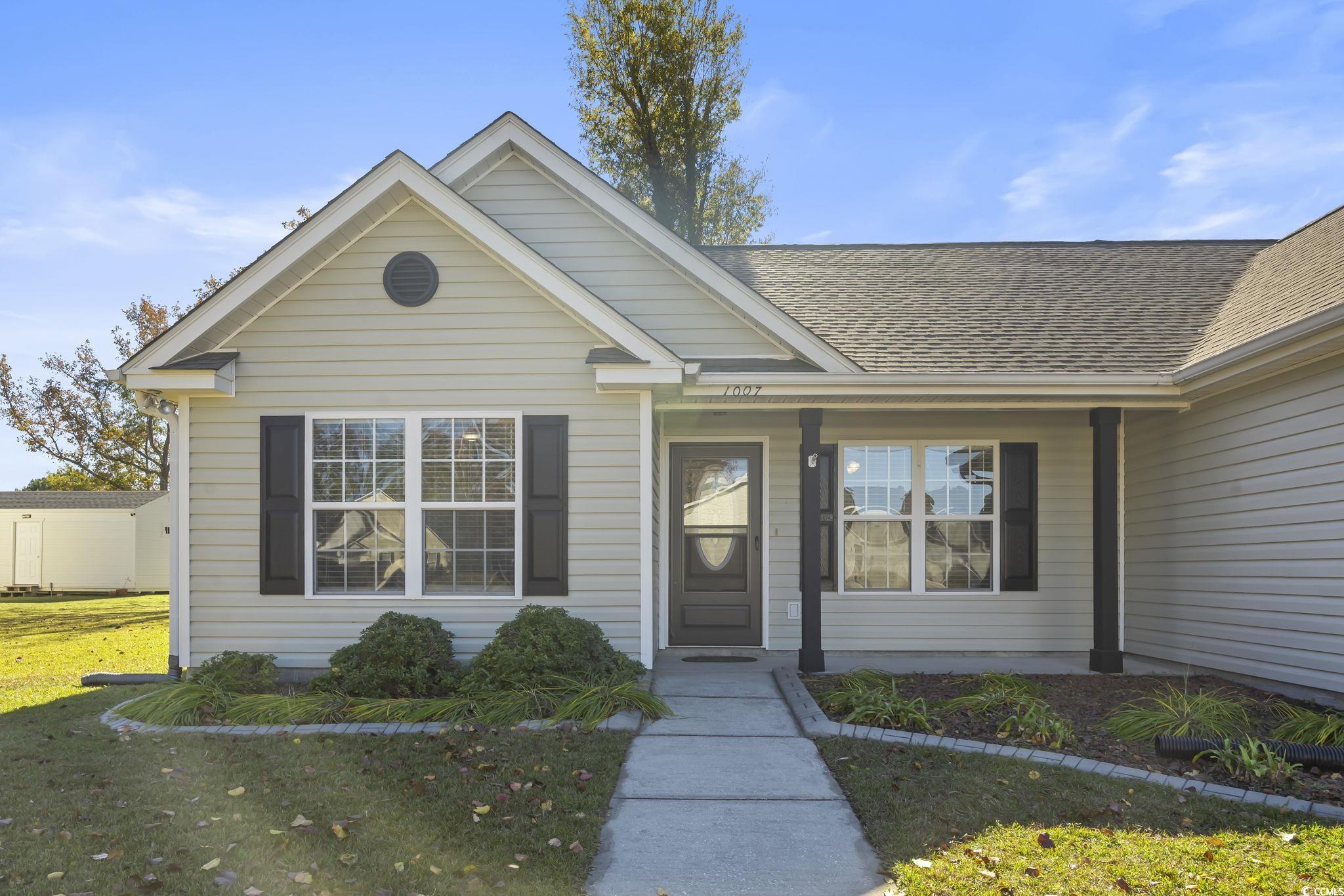 1007 Green Fir Loop Conway, SC 29527 - Photo 38 of 38 Property entrance with a lawn and a shingled roof