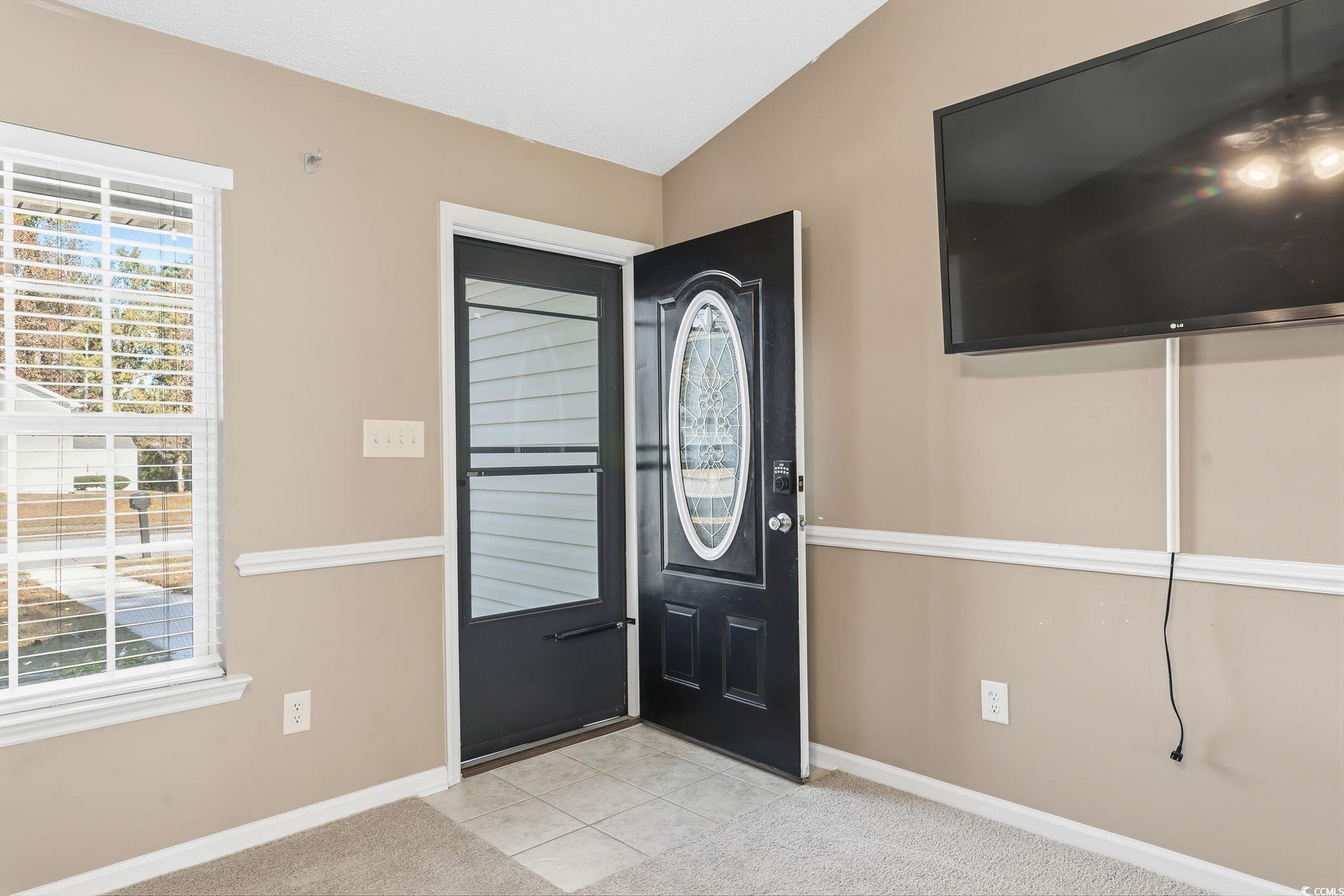 1007 Green Fir Loop Conway, SC 29527 - Photo 4 of 38 Entryway featuring light tile patterned flooring and light carpet