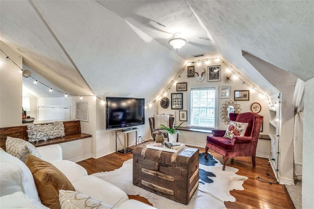 5910 McCommas Boulevard Dallas, TX 75206 - Photo 17 of 22 a living room with furniture a large window and a flat screen tv