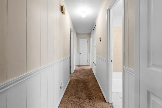 a bathroom with a granite countertop sink a toilet and shower