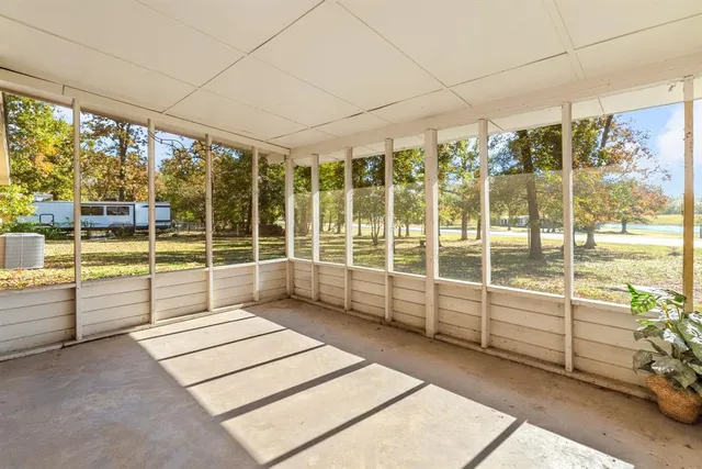 a view of a hallway with a white walls