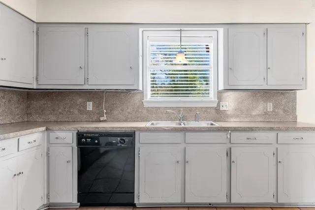 a kitchen with stainless steel appliances granite countertop a refrigerator sink and cabinets