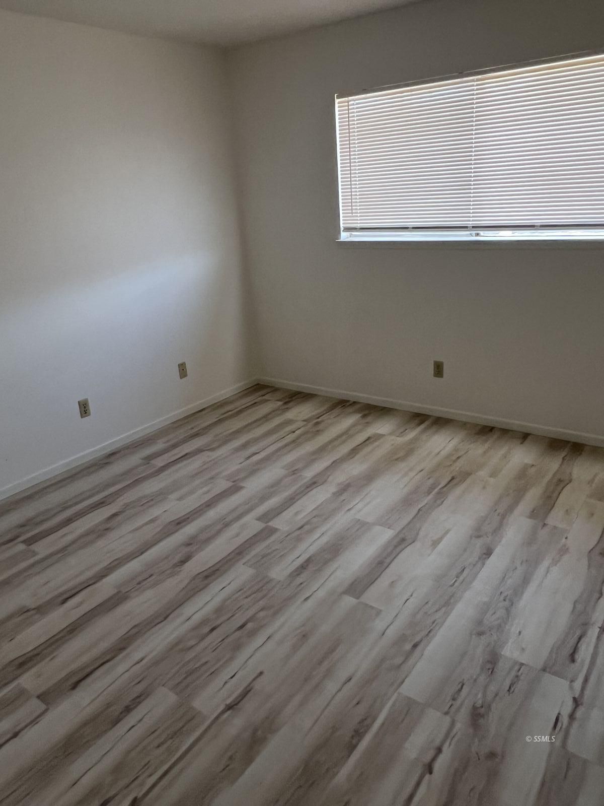 209 South Gold Canyon Street Ridgecrest, CA 93555 - Photo 23 of 33 a view of a room with wooden floor