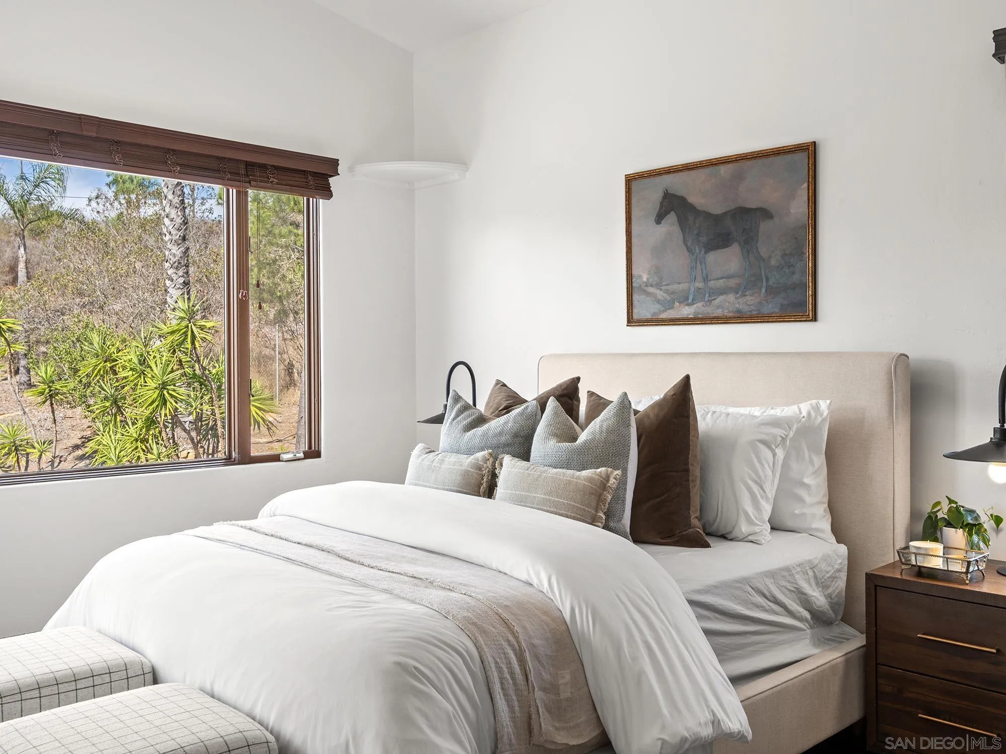 3485 Lone Jack Road Encinitas, CA 92024 - Photo 13 of 27 a bedroom with a bed and a painting on the wall