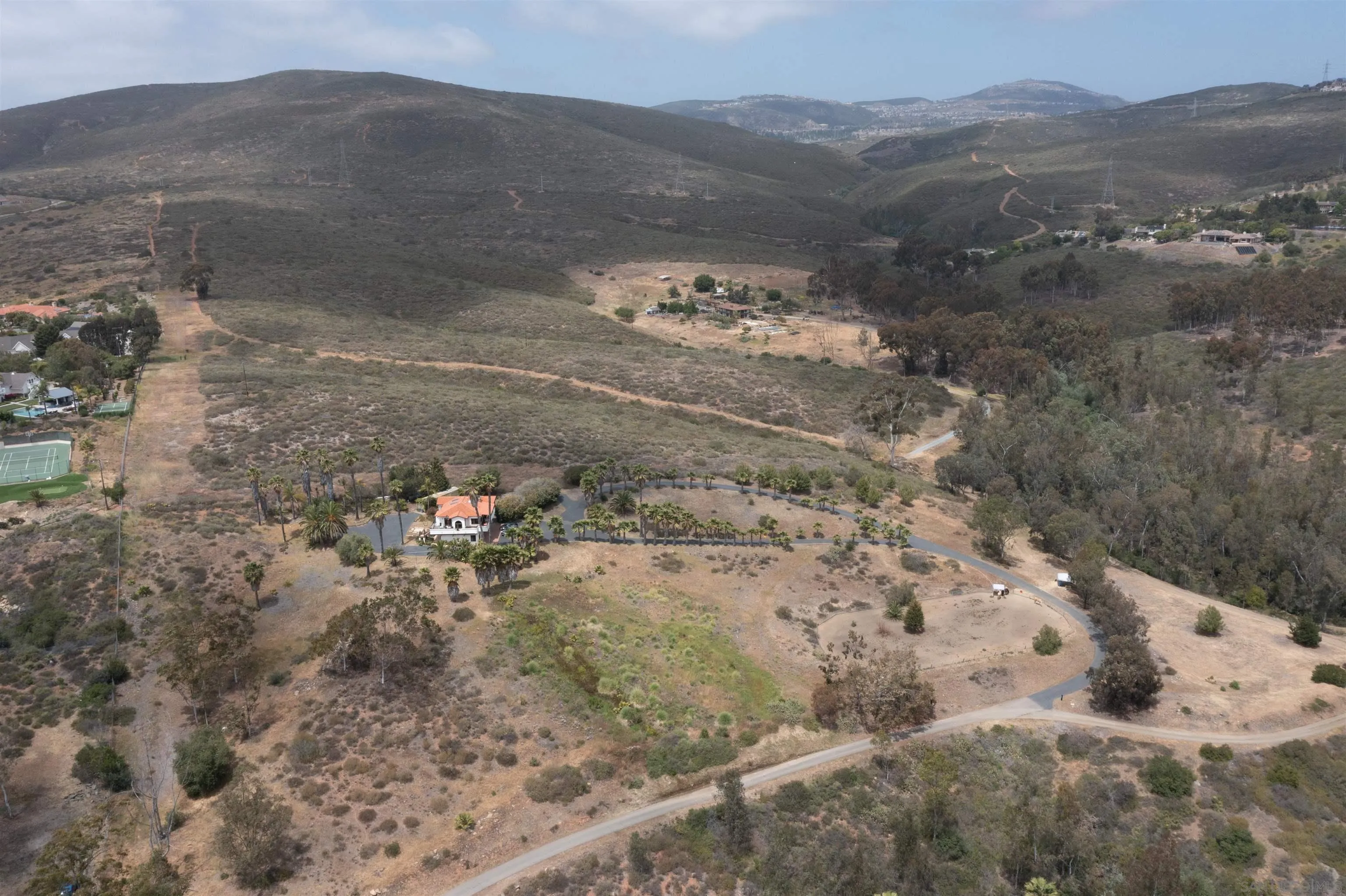 3485 Lone Jack Road Encinitas, CA 92024 - Photo 22 of 27 a view of a wooden house with a yard