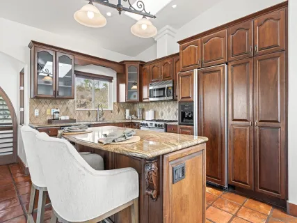 a kitchen that has a cabinets a sink and appliances
