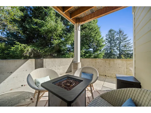 a backyard of a house with table and chairs
