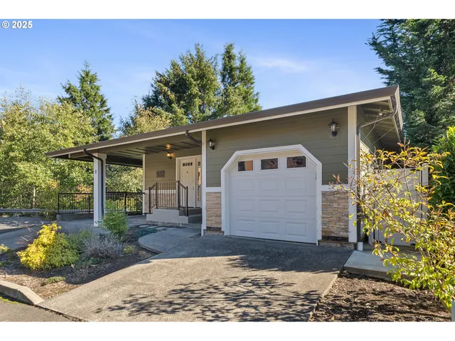 an aerial view of a house with a lake view